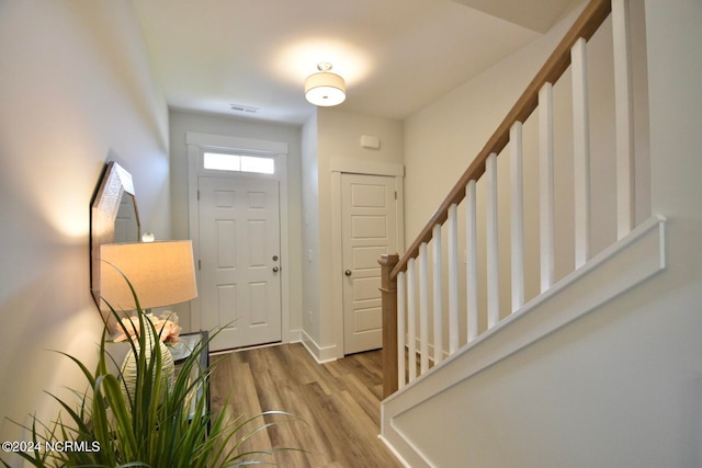 entryway with light hardwood / wood-style flooring