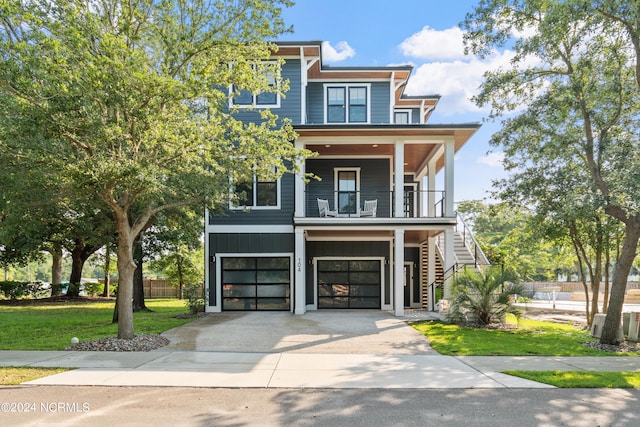 view of front facade featuring a front yard and a garage