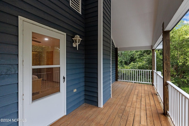 wooden terrace with a porch