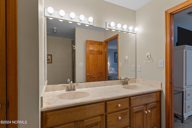 bathroom featuring vanity and a shower with door