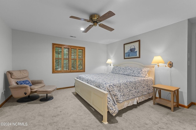 bedroom featuring ceiling fan and light colored carpet