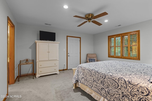 bedroom with light colored carpet and ceiling fan