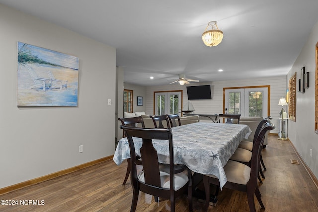 dining area featuring ceiling fan, french doors, and hardwood / wood-style flooring