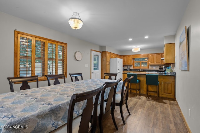 dining room featuring dark hardwood / wood-style floors and sink