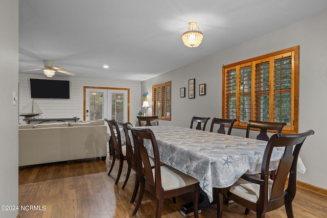 dining area featuring ceiling fan, french doors, and hardwood / wood-style flooring