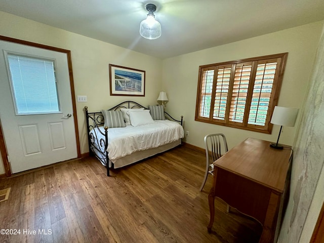 bedroom with hardwood / wood-style floors