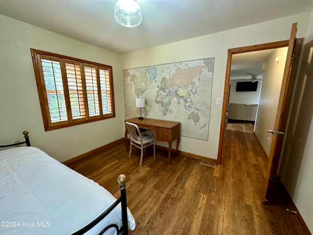 bedroom featuring hardwood / wood-style flooring