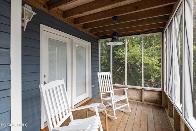 sunroom with beam ceiling