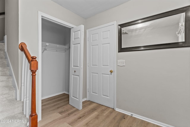 interior space with light hardwood / wood-style flooring and a closet