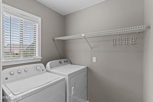 laundry area with separate washer and dryer