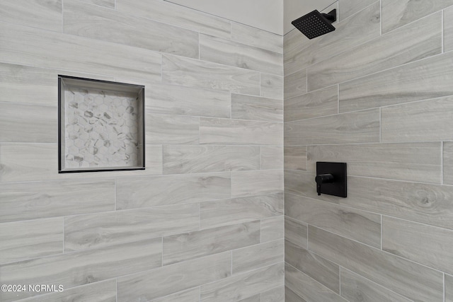 details featuring tiled shower