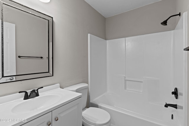 full bathroom featuring vanity, toilet, and shower / washtub combination