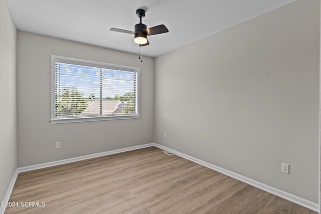 unfurnished room featuring ceiling fan and light wood-type flooring