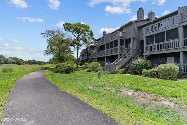 view of home's community featuring a yard