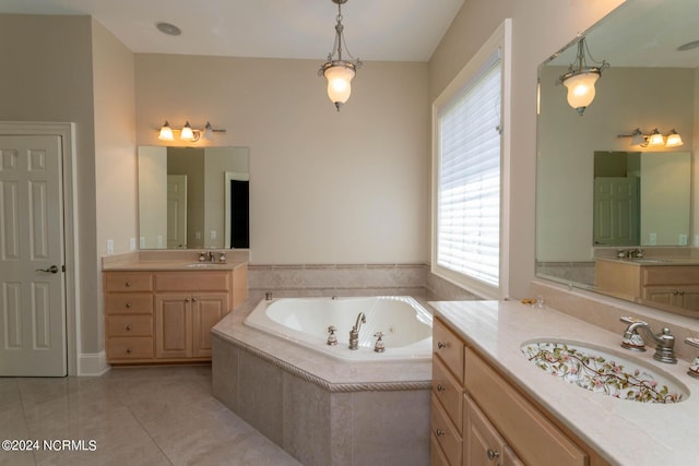 full bathroom with a jetted tub, two vanities, a sink, and tile patterned flooring