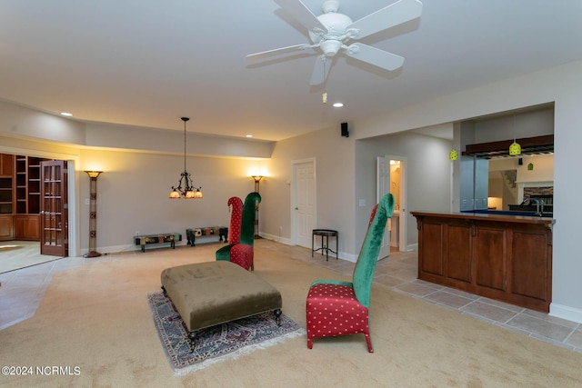 interior space featuring baseboards, recessed lighting, a ceiling fan, and light colored carpet