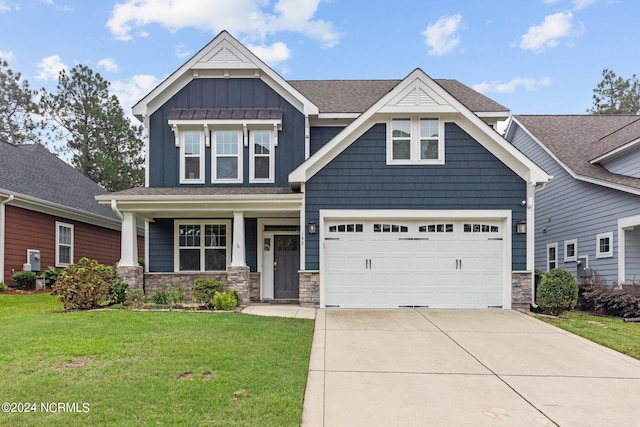 craftsman house featuring covered porch and a front yard