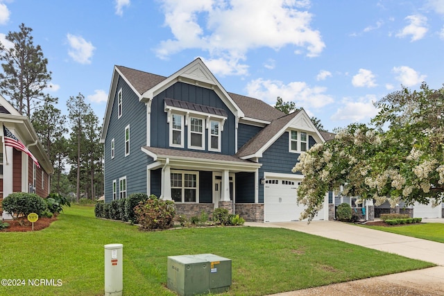 craftsman house featuring a front yard and a garage