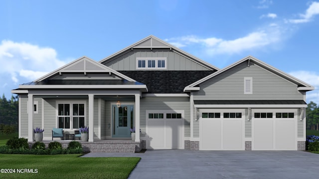 craftsman house with a garage and a front yard