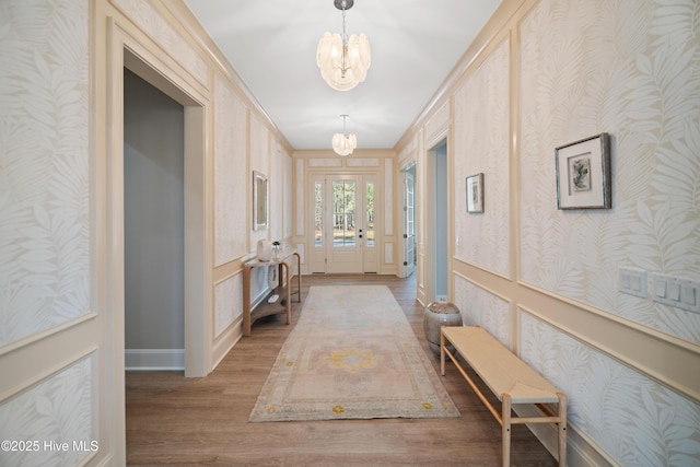3772 Barnesmore Dr, Castle Hayne, NC 28429 - hall with a chandelier, wood finished floors, and wallpapered walls