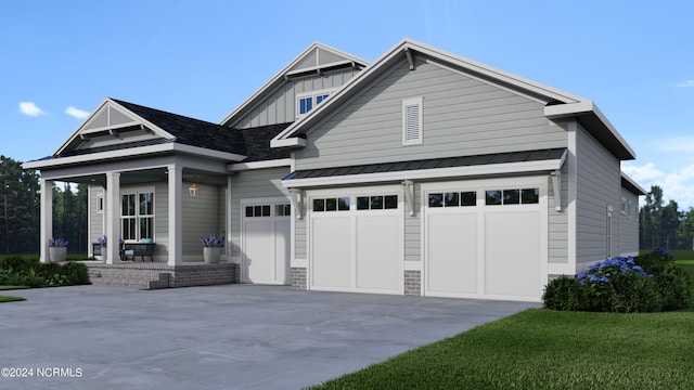 craftsman inspired home with a garage and a front yard