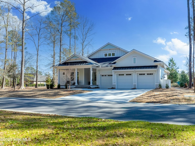 3772 Barnesmore Dr, Castle Hayne, NC 28429 - modern farmhouse style home with a standing seam roof, concrete driveway, covered porch, a metal roof, and board and batten siding