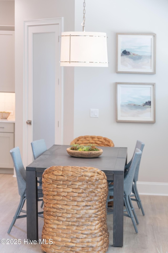 3772 Barnesmore Dr, Castle Hayne, NC 28429 - dining room featuring light wood-type flooring and baseboards