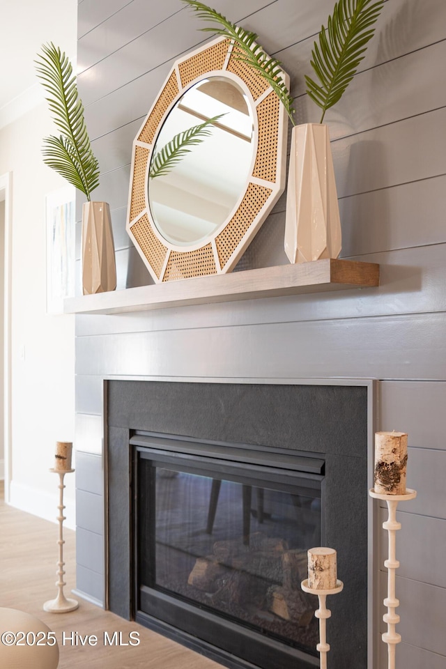 3772 Barnesmore Dr, Castle Hayne, NC 28429 - detailed view of a glass covered fireplace and wood finished floors