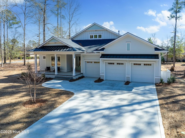 3772 Barnesmore Dr, Castle Hayne, NC 28429 - modern inspired farmhouse featuring a standing seam roof, a porch, driveway, a metal roof, and board and batten siding