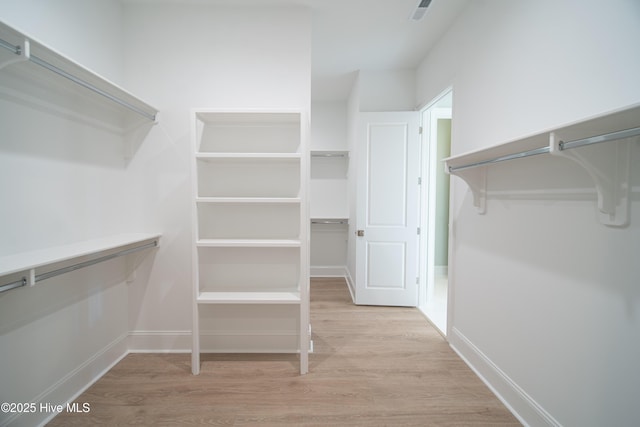 3772 Barnesmore Dr, Castle Hayne, NC 28429 - walk in closet featuring wood finished floors