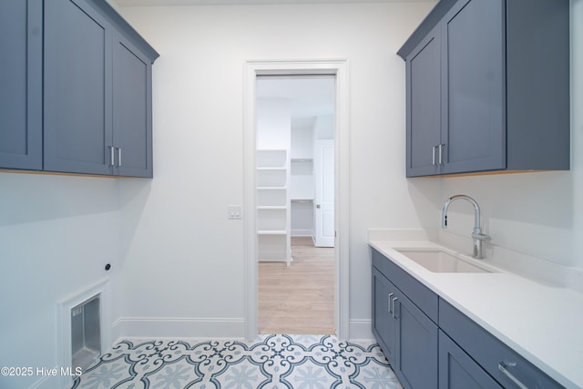 3772 Barnesmore Dr, Castle Hayne, NC 28429 - laundry room featuring hookup for an electric dryer, cabinet space, and light tile patterned flooring