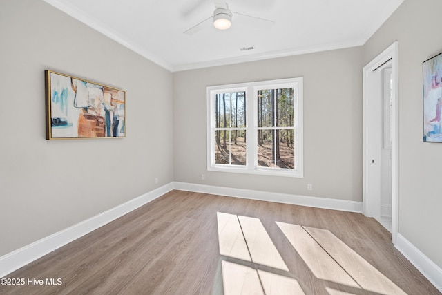 3772 Barnesmore Dr, Castle Hayne, NC 28429 - empty room featuring wood finished floors, a ceiling fan, and crown molding