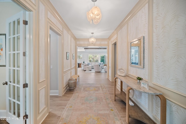 3772 Barnesmore Dr, Castle Hayne, NC 28429 - hall with light wood finished floors and a chandelier