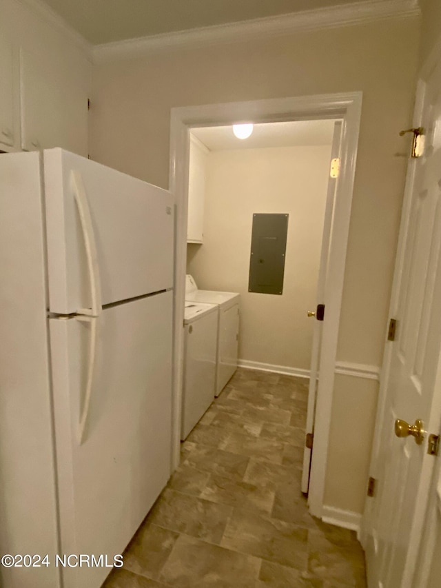 laundry area featuring cabinets, ornamental molding, electric panel, and washing machine and dryer