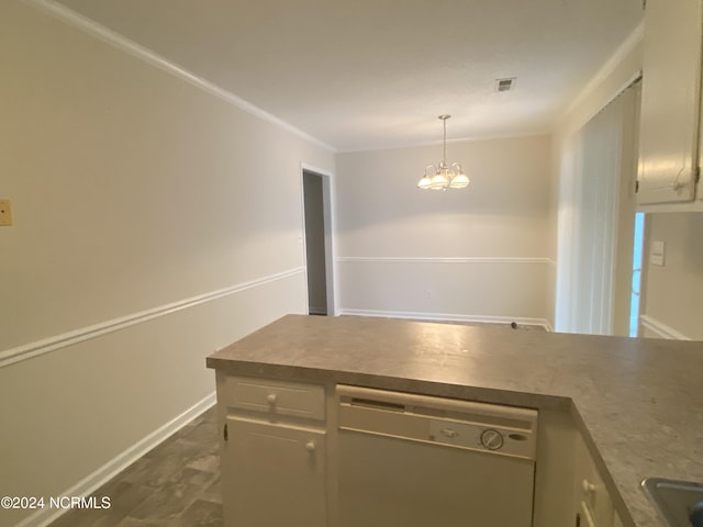 kitchen featuring dishwasher, pendant lighting, and a chandelier