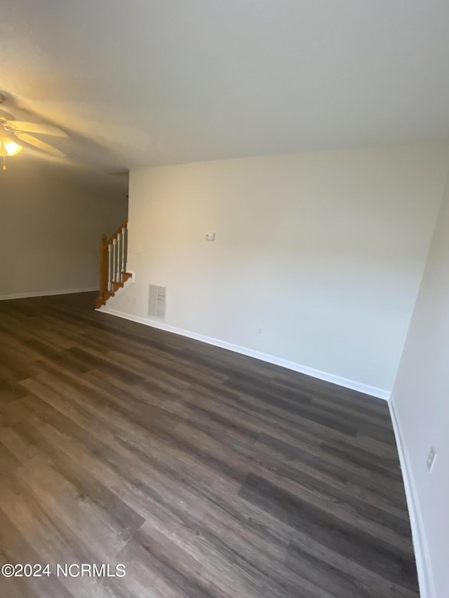 empty room featuring dark wood-type flooring