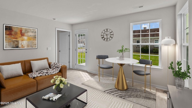 living room with light hardwood / wood-style flooring