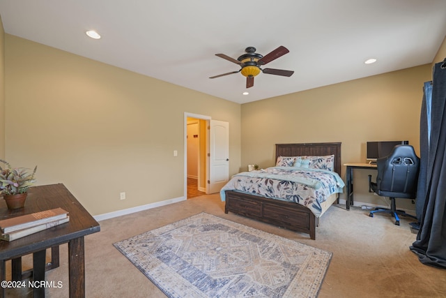 bedroom featuring light colored carpet and ceiling fan