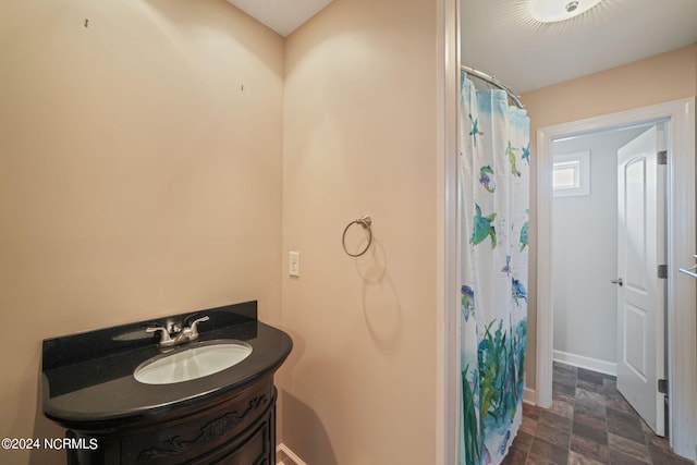 bathroom featuring vanity and a shower with shower curtain