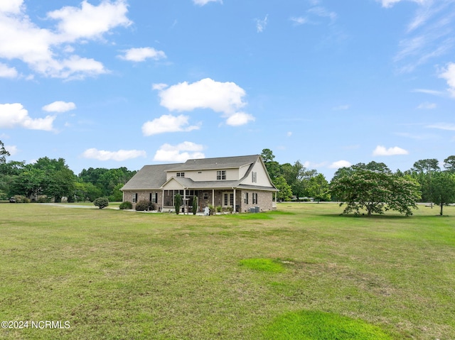 cape cod-style house featuring a front lawn