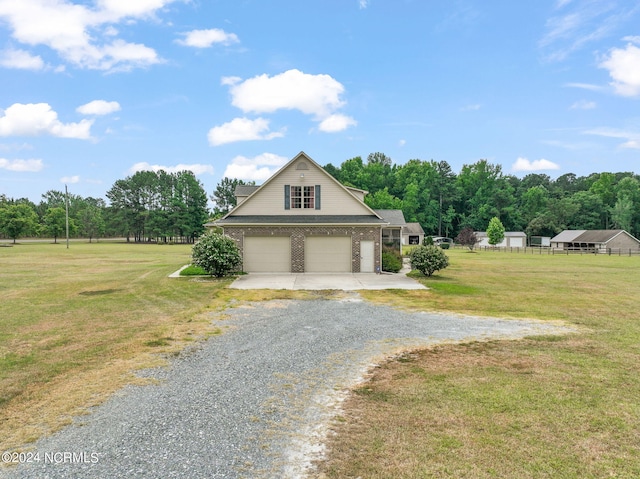 garage featuring a lawn