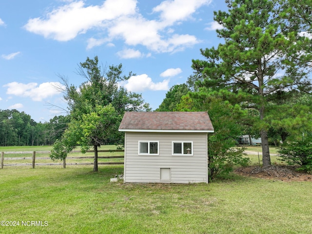 view of outdoor structure with a lawn