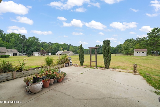 view of patio / terrace featuring an outbuilding