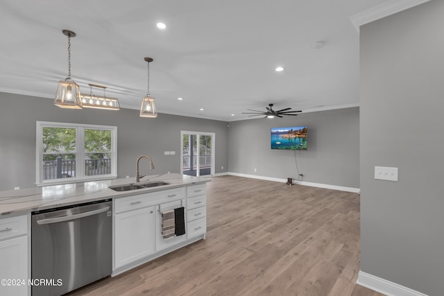 kitchen with crown molding, stainless steel dishwasher, sink, and white cabinets