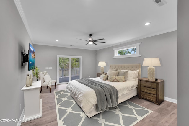 bedroom with multiple windows, ornamental molding, access to exterior, and light wood-type flooring