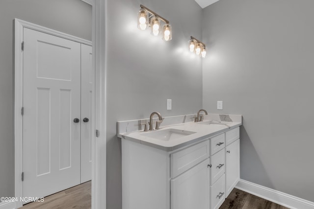 bathroom featuring vanity and wood-type flooring