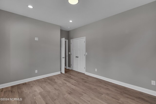 spare room featuring light wood-type flooring