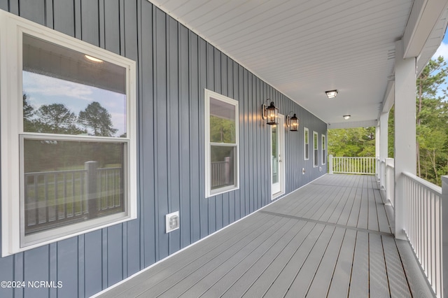 wooden terrace featuring covered porch