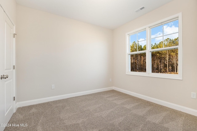 unfurnished room featuring carpet flooring