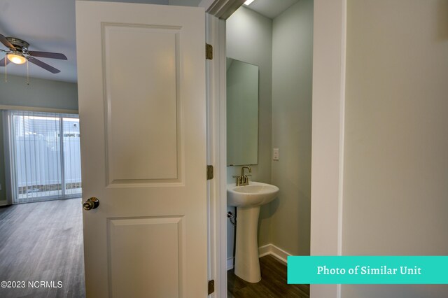 bathroom featuring hardwood / wood-style floors and toilet